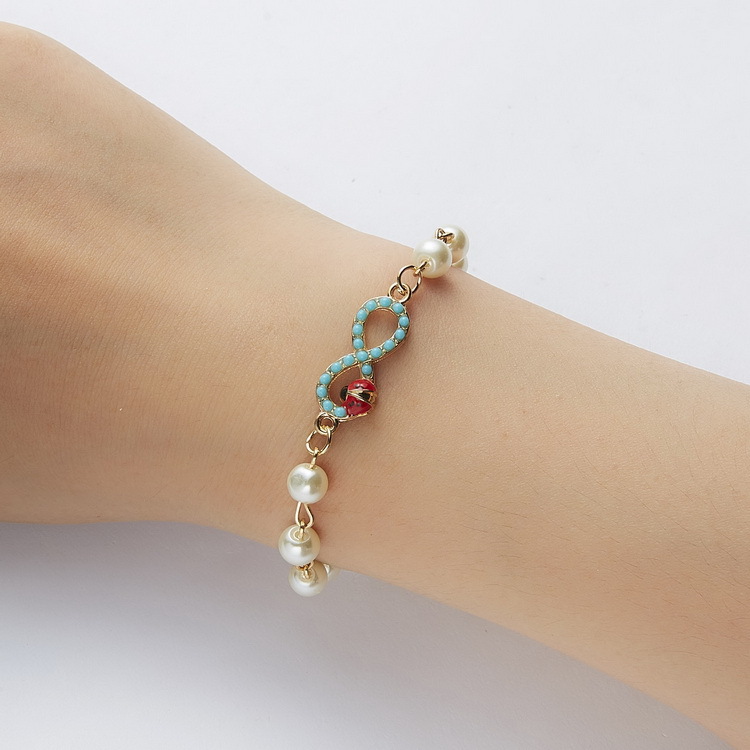 Adjustable Multi-Style Hollow Rhinestone Pearl Bracelet for Every Occasion - Image 40